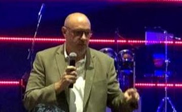 Peter Ramis, founder of FaithCore Lab, speaking at a live event